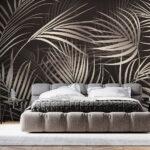 Papier peint Feuilles tropicales sur fond sombre.