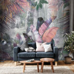 Papier peint Feuilles tropicales colorées contre un mur.