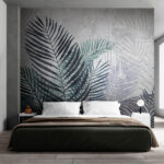 Papier peint Les feuilles tropicales créent un motif artistique.