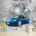 Papier peint Une voiture bleue traverse un mur de briques