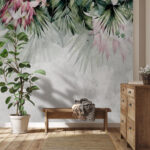 Papier peint Motif de feuilles et de fleurs tropicales.