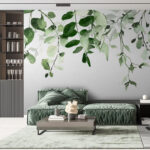 Papier peint Feuilles vertes aquarellées sur fond blanc.