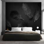Papier peint Plume noire sur une surface noire