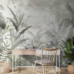 Papier peint Feuilles tropicales dans un jardin brumeux.