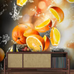 Papier peint Oranges tombant dans l'eau avec éclaboussures