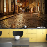Papier peint Rue en pierre avec bâtiments et lampadaires