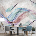Papier peint Plumes colorées sur une surface blanche