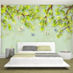 Papier peint Feuilles vertes et papillons sur fond blanc