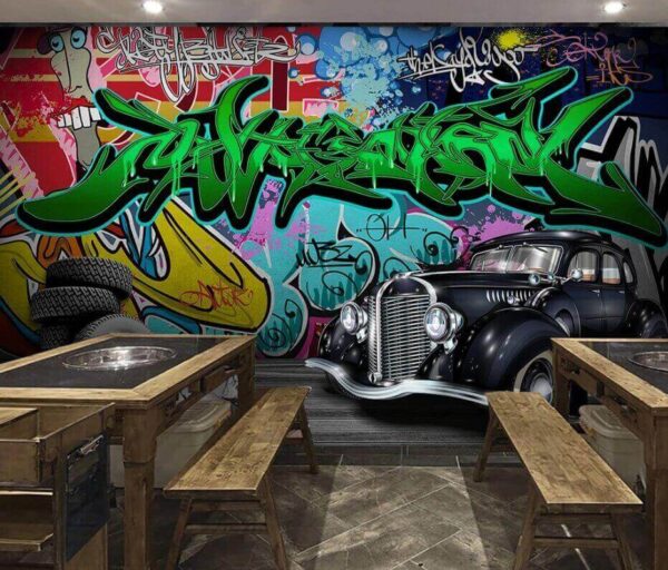 Voiture noire avec roues devant un mur coloré Papier peint Voiture noire avec roues devant un mur coloré