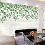 Papier peint Mur de briques blanches avec des feuilles vertes