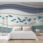 Papier peint Groupe de poissons bleus nageant dans un groupe de vagues