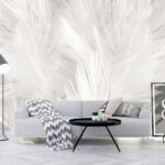 Papier peint Plumes blanches sur une surface blanche
