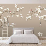 Papier peint Moineaux se reposant sur les branches en fleurs.