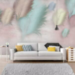 Papier peint Groupe de plumes sur fond rose