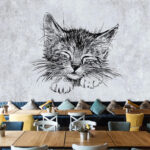 Papier peint Dessin de chaton endormi sur papier.