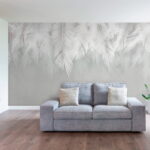 Papier peint Motif de feuilles blanches sur fond gris.