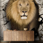 Papier peint Lion traversant un mur de fissures