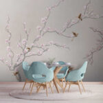 Papier peint Des oiseaux perchés sur des branches en fleurs.