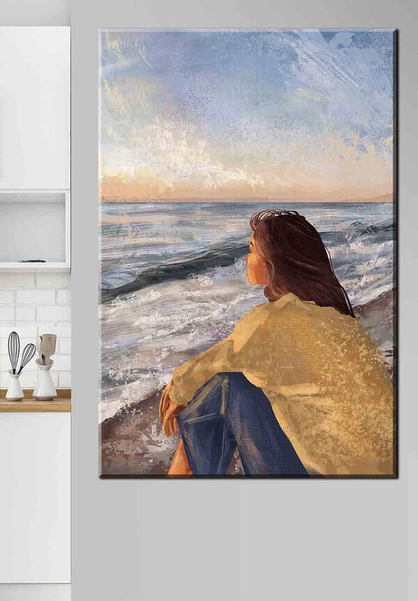 Femme assise sur une plage regardant l'océan Tableaux Femme assise sur une plage regardant l'océan
