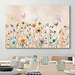 Tableaux Des papillons colorés dansent au-dessus des fleurs sauvages.