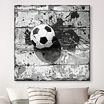 Tableaux Ballon de football sur un mur de briques