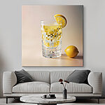 Tableaux Verre de liquide avec un quartier de citron et un citron sur le côté