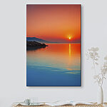 Tableaux Canvas prints Sunset over a body of water