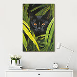 Tableaux Chat noir aux yeux orange regardant à travers de grandes plantes vertes