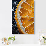 Tableaux Tranche d'orange avec des gouttelettes scintillantes.