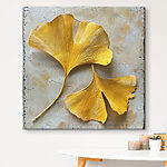 Tableaux Feuilles jaunes sur une surface blanche