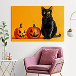 Tableaux Chat noir assis à côté de deux citrouilles sculptées