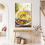 Tableaux Bol de soupe avec des légumes verts sur une assiette