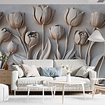 Papier peint Sculpture de fleurs blanches sur un mur