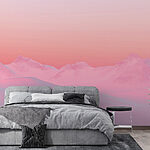 Papier peint Ciel rose et bleu sur une chaîne de montagnes enneigées