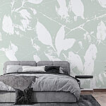 Papier peint Feuilles blanches sur fond vert clair