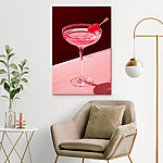 Tableaux Verre avec un liquide rose et deux cerises dessus