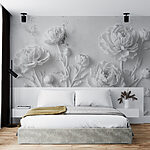 Papier peint Sculpture de fleurs blanches sur un mur
