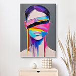 Tableaux Peinture d'une femme avec de la peinture colorée sur son visage