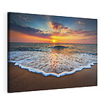 Tableaux Les vagues du coucher du soleil embrassent le rivage