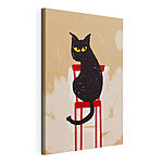 Tableaux Chat noir assis sur une chaise rouge