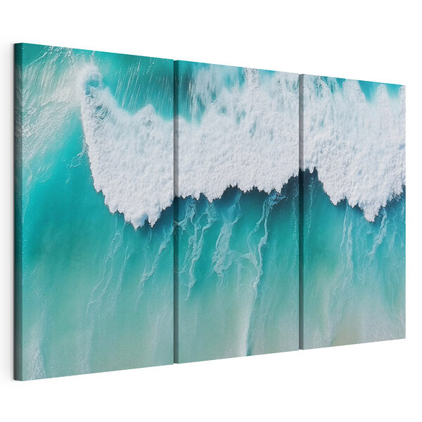 Les vagues déferlent sur la plage de sable Impression sur toile modulaire Les vagues déferlent sur la plage de sable